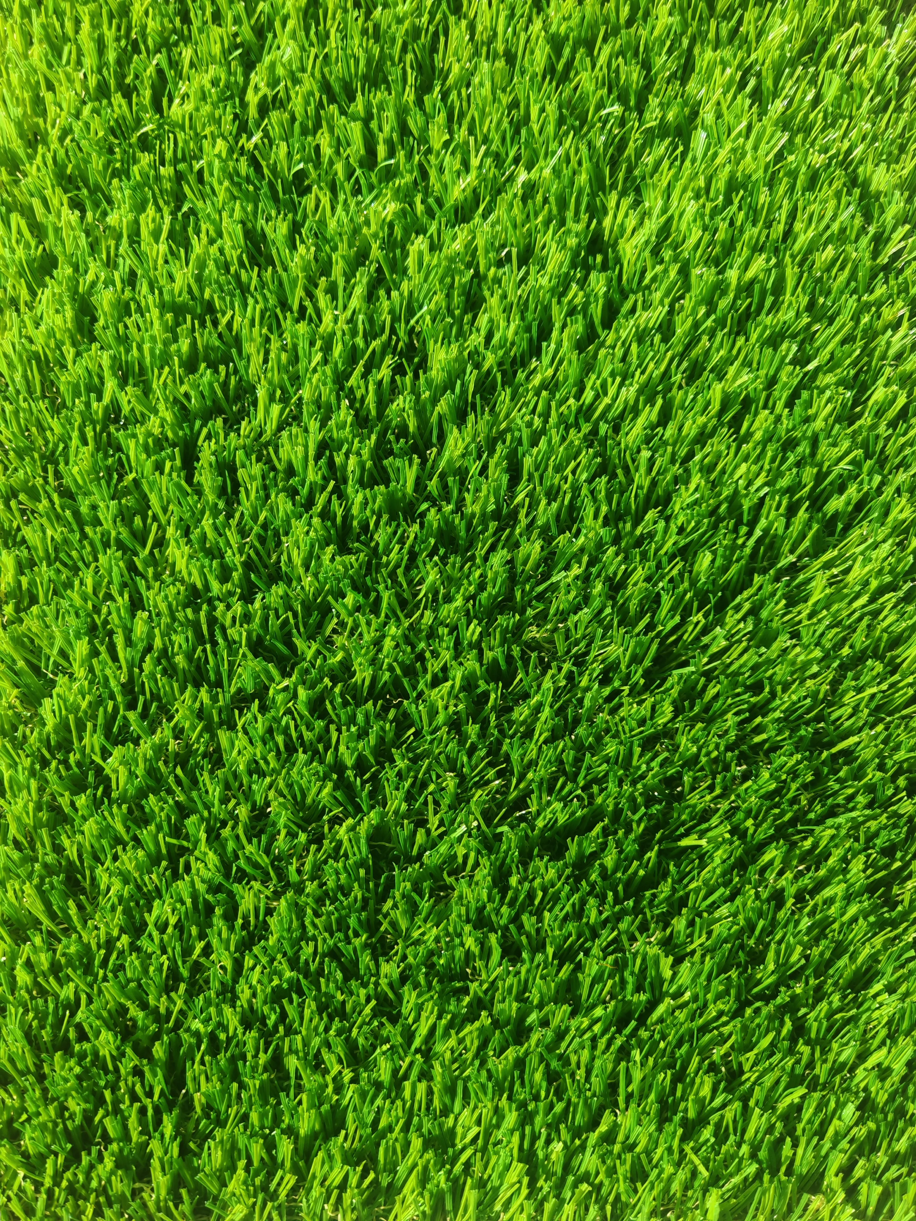 Vibrant 35mm green artificial turf close-up
